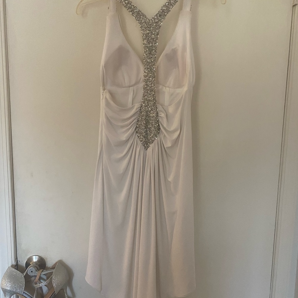 White cocktail dress.  Sequins tee back.